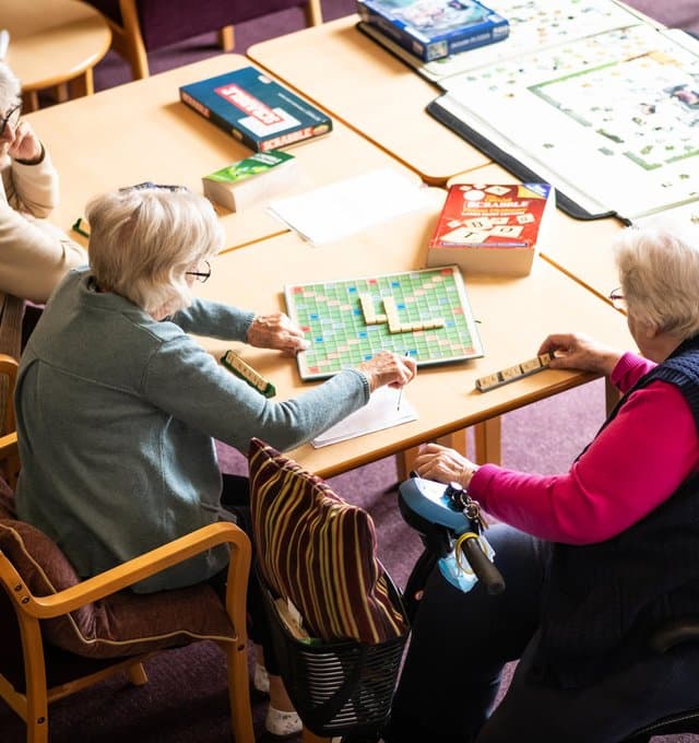 Older ladies playing board games