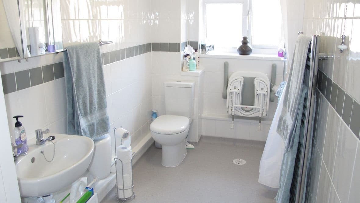 level access shower with seat folded up